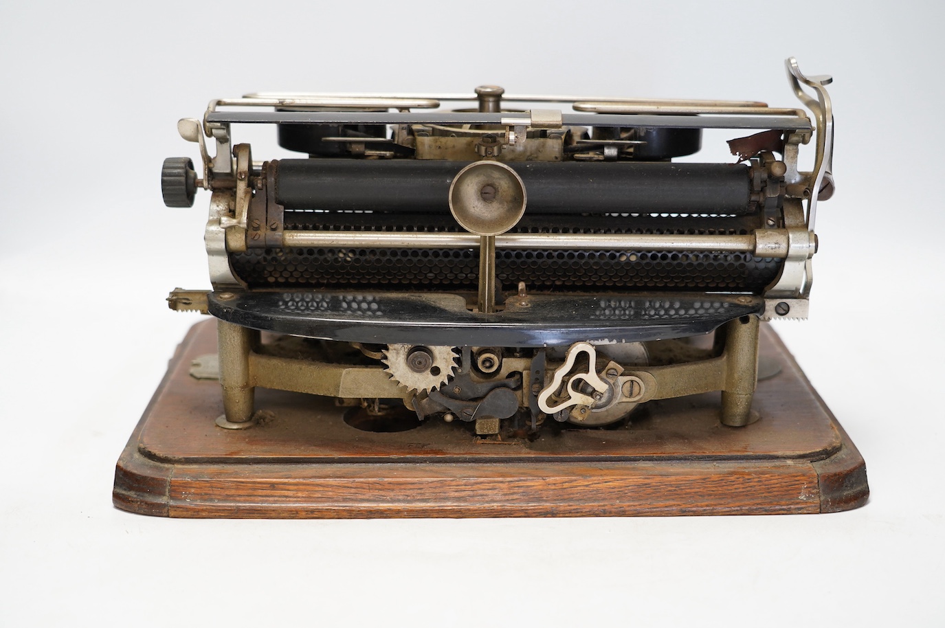 A scarce early 20th century Hammond Multiplex typewriter, with convex keyboard in an oak plywood case, case 20cm high, 35cm wide, 33cm deep. Condition - poor to fair, two keys missing and others worn or broken